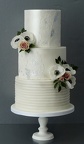 Lace and flower wedding cake
