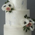 Lace and flower wedding cake