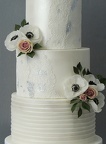 Lace and flower wedding cake